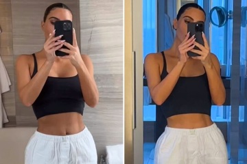 Kim shows off her thin arms & tiny waist in a crop top and pants for new video